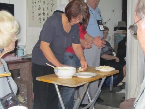 Woman in Beijing, China making dumplings